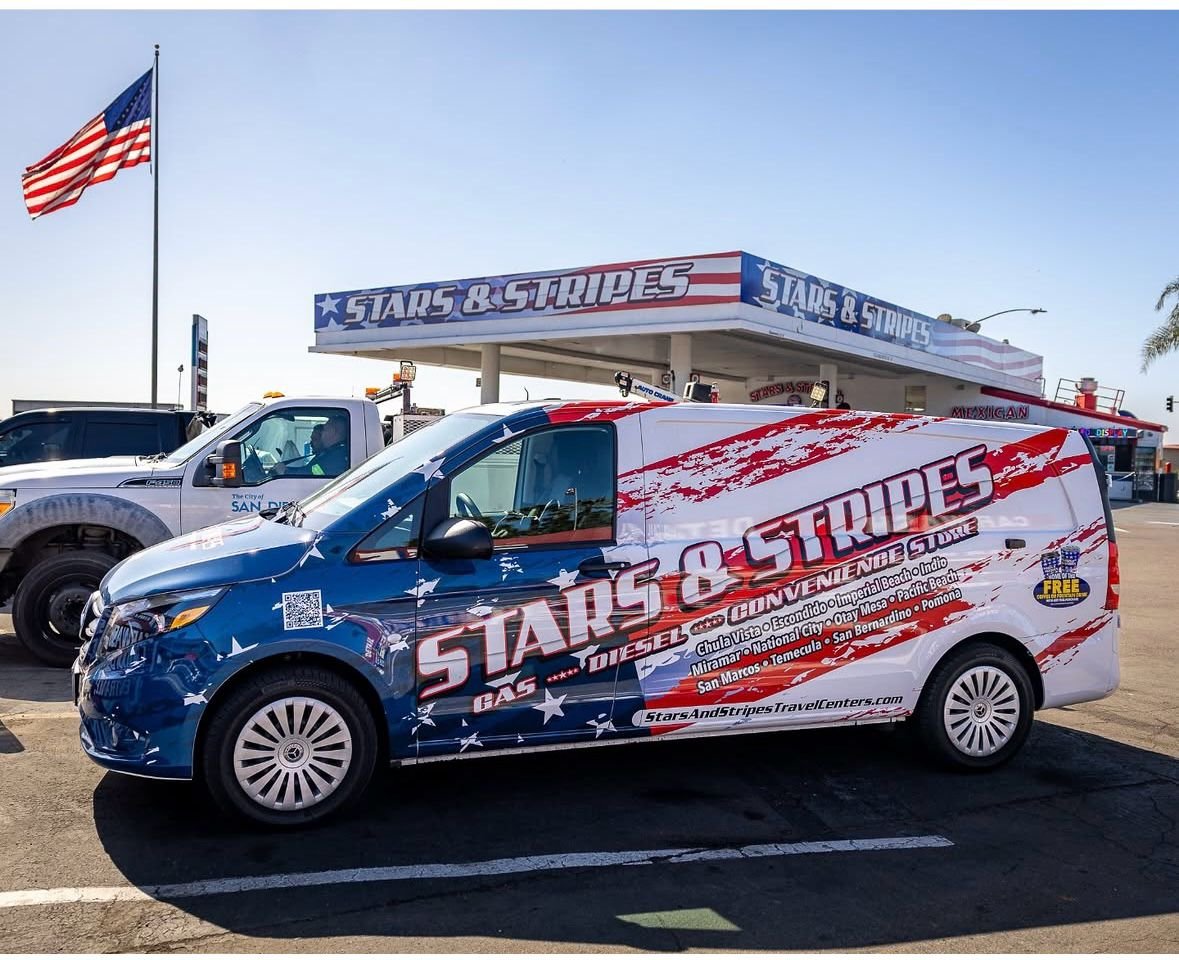 Stars and Stripes branded van at a travel center